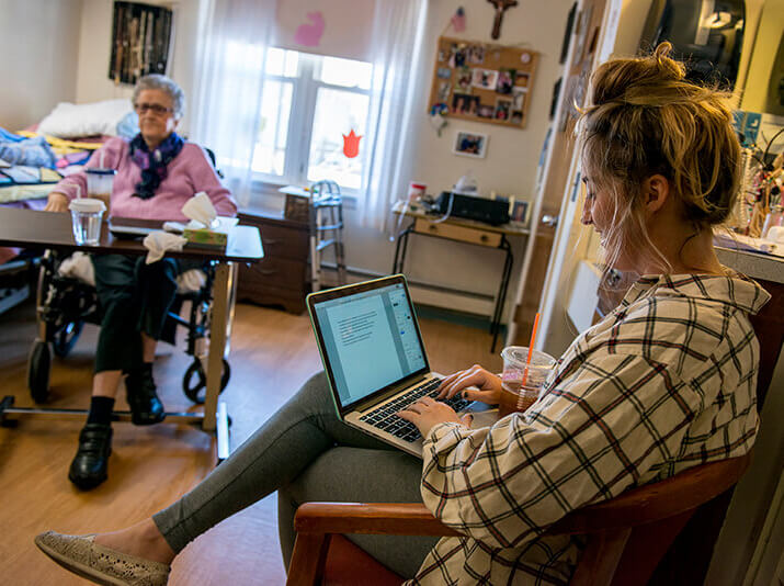 A student interviews a woman