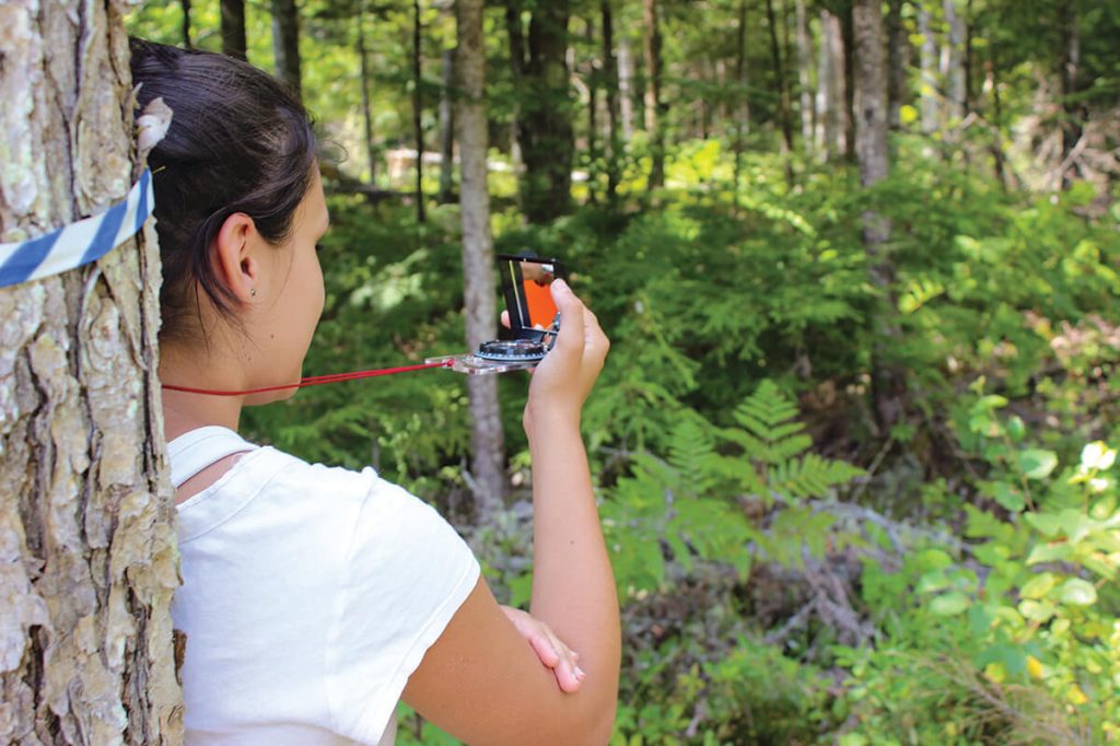 Student with a compass