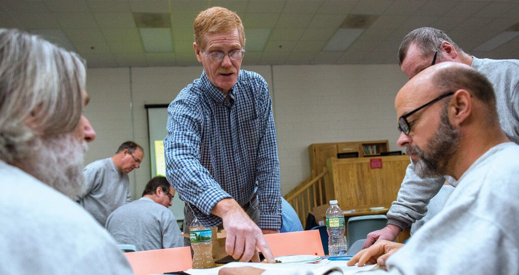 Mark Hutchinson instructs inmates