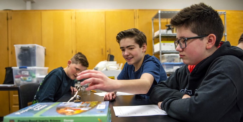 Boys running an experiment