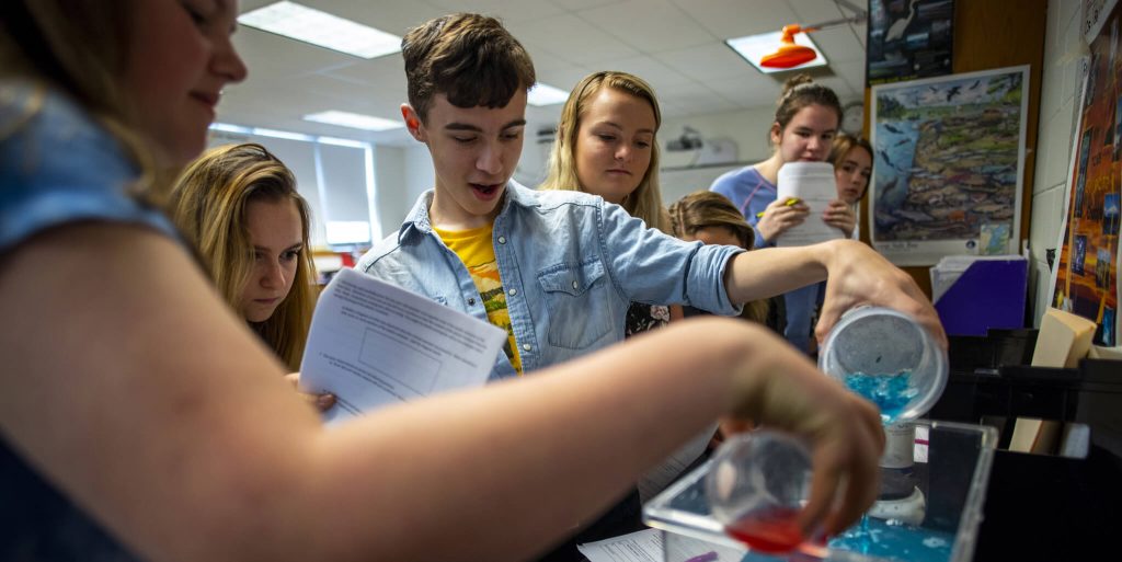 Students conduct an experiment